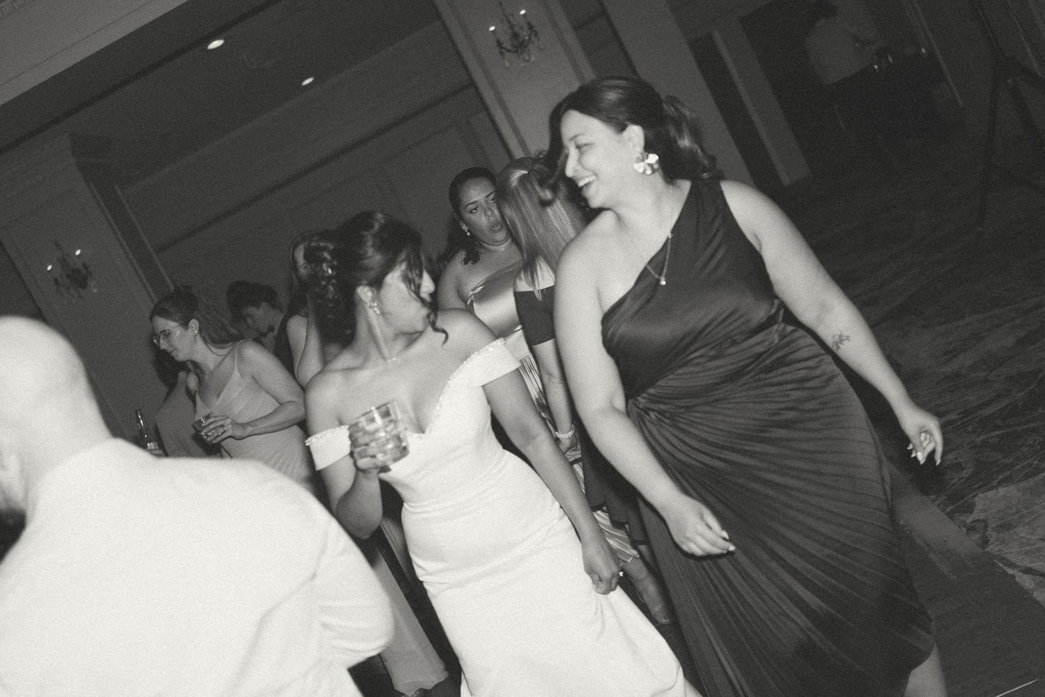 A group of people dancing and socializing at what appears to be a wedding reception or party in Halifax, Nova Scotia.
