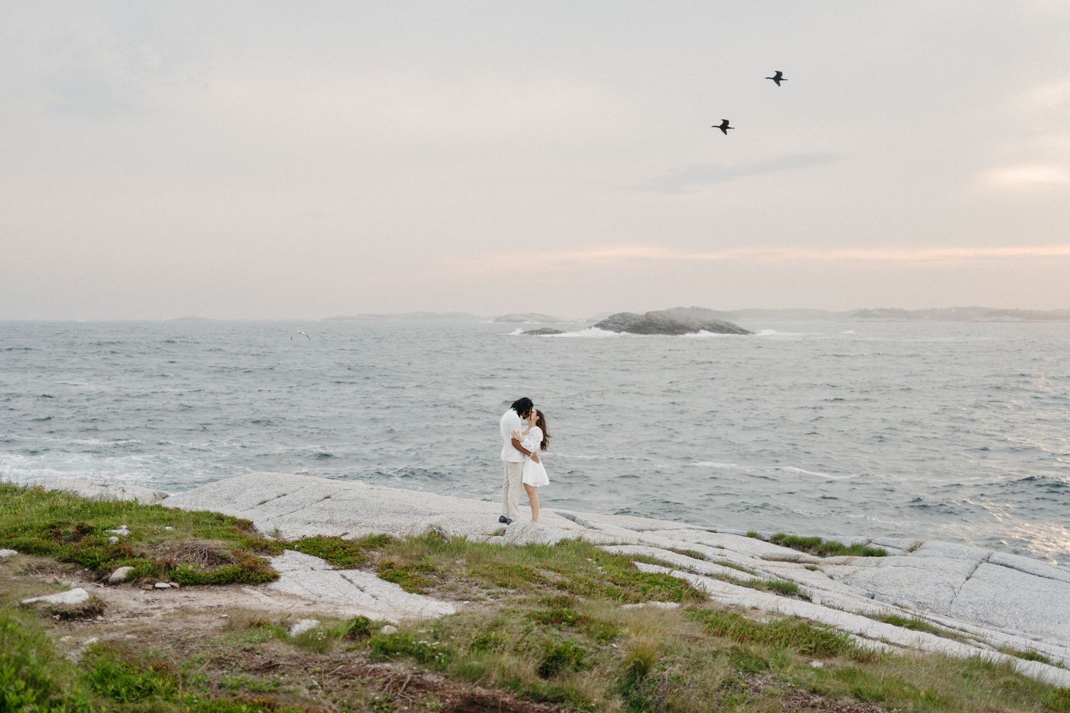 A series of coastal images showing rocky shores, ocean waves, and distant islands at sunset in Halifax, Nova Scotia.