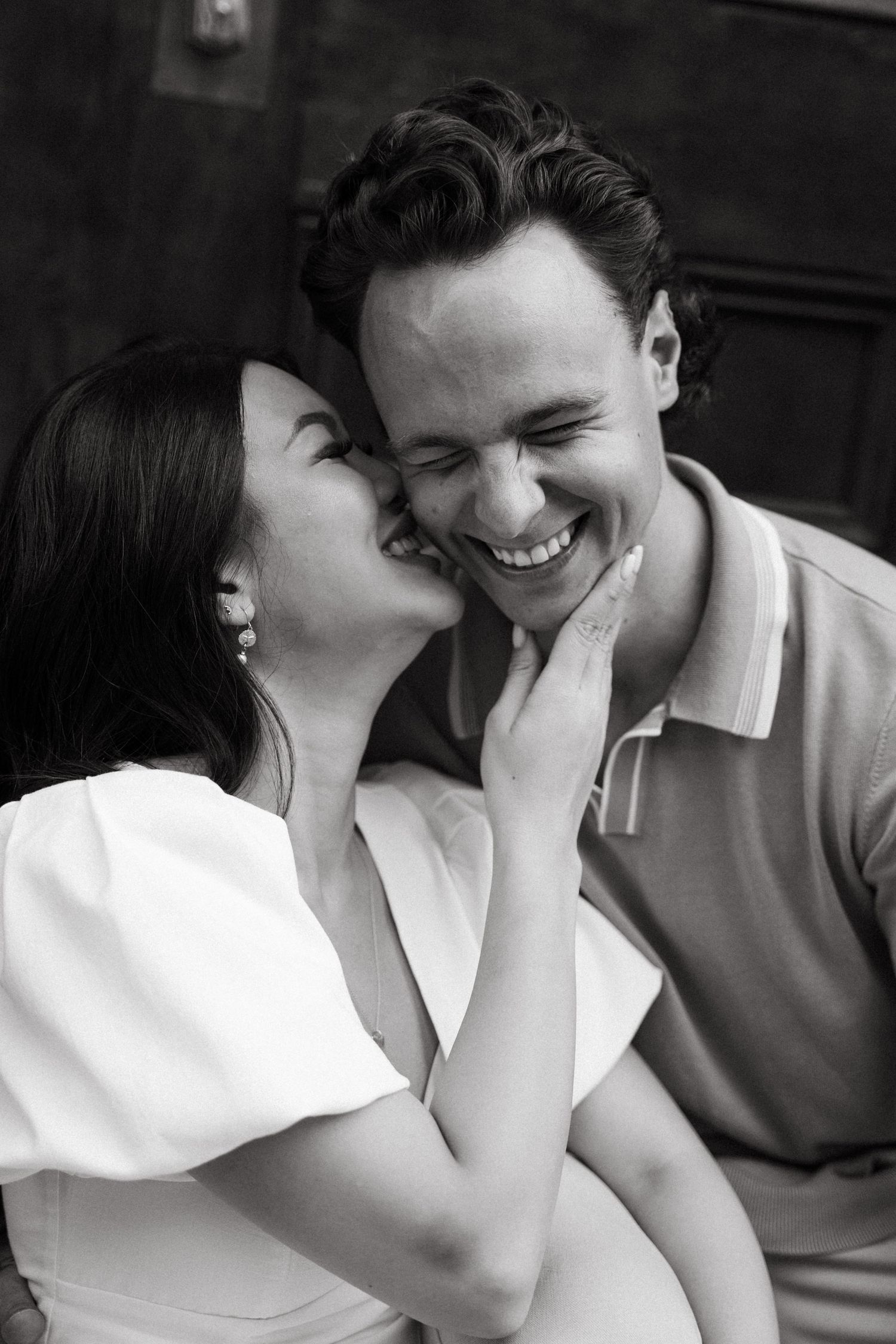 A romantic black and white photo sequence showing a couple sharing an intimate kiss in Halifax, Nova Scotia.