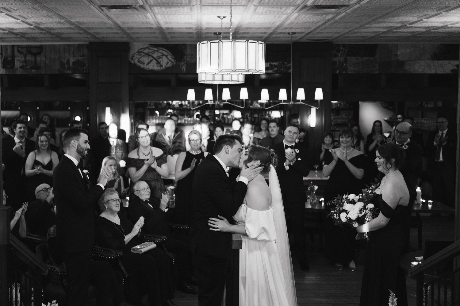 A black and white photo montage shows various scenes from a wedding reception with dancing and celebration at Lord Nelson Hotel, Halifax.
