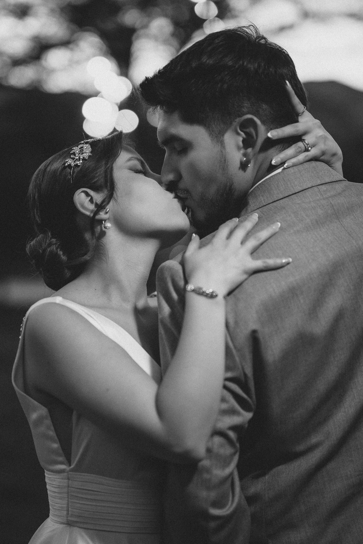 Black and white photo series showing romantic wedding couple kissing in intimate close-up shots.