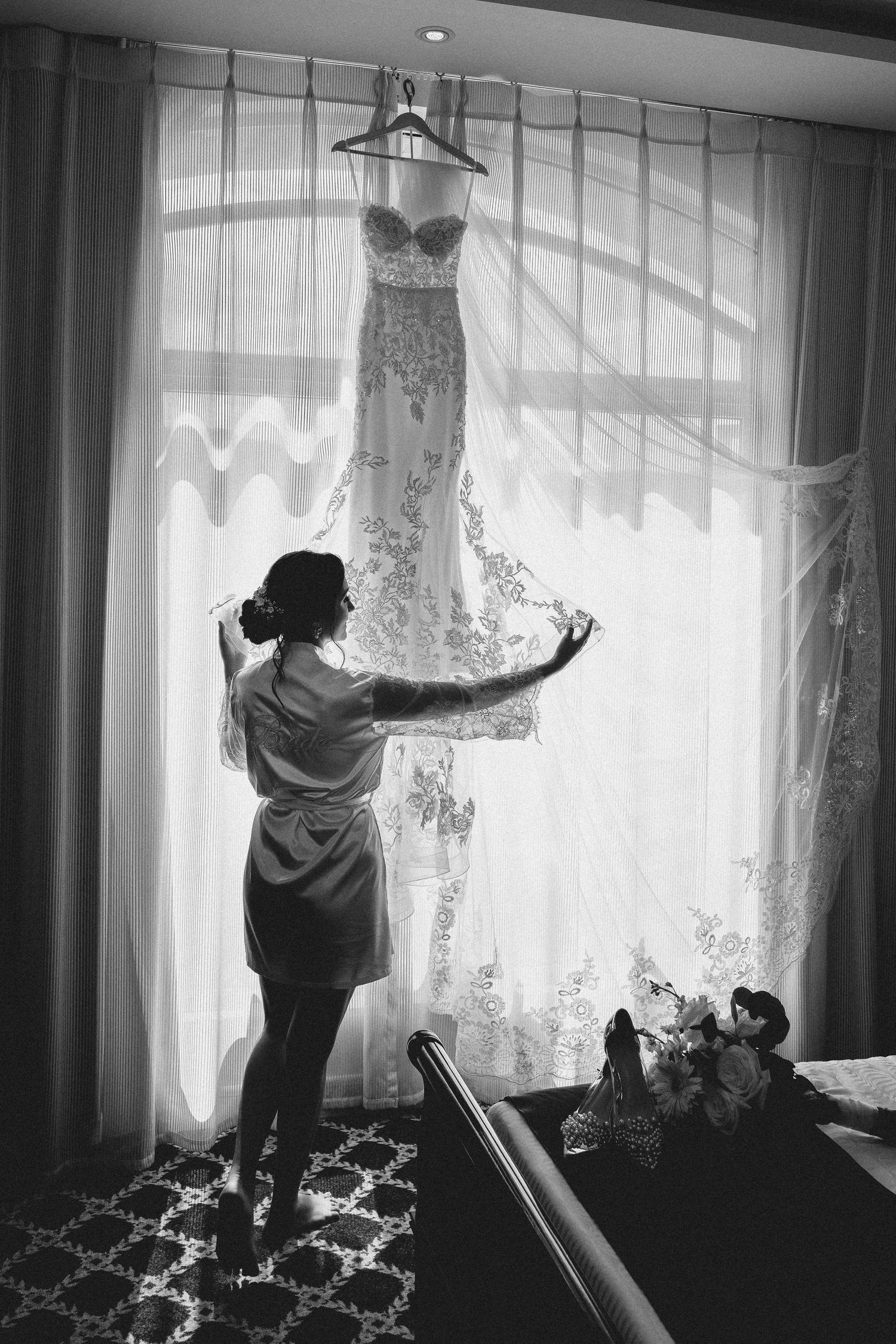 A series of black and white photos showing someone opening curtains to let sunlight stream through lace window coverings.