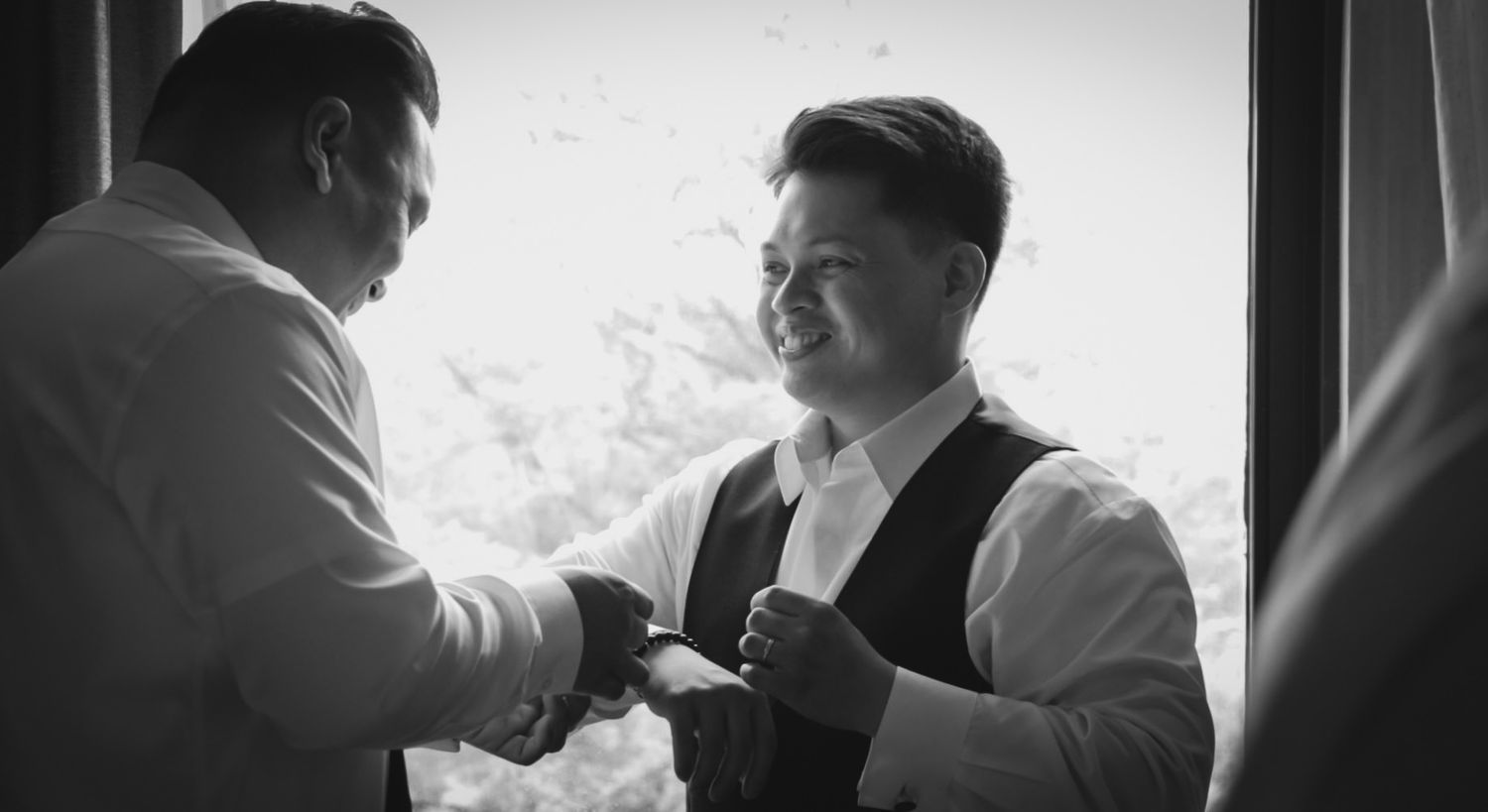 Black and white candid moments between wedding party members.