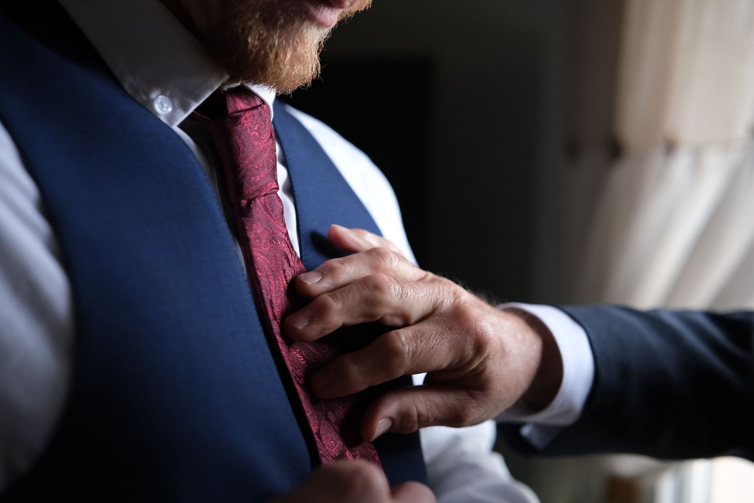 Close-up details of formal attire and accessories in black and white.