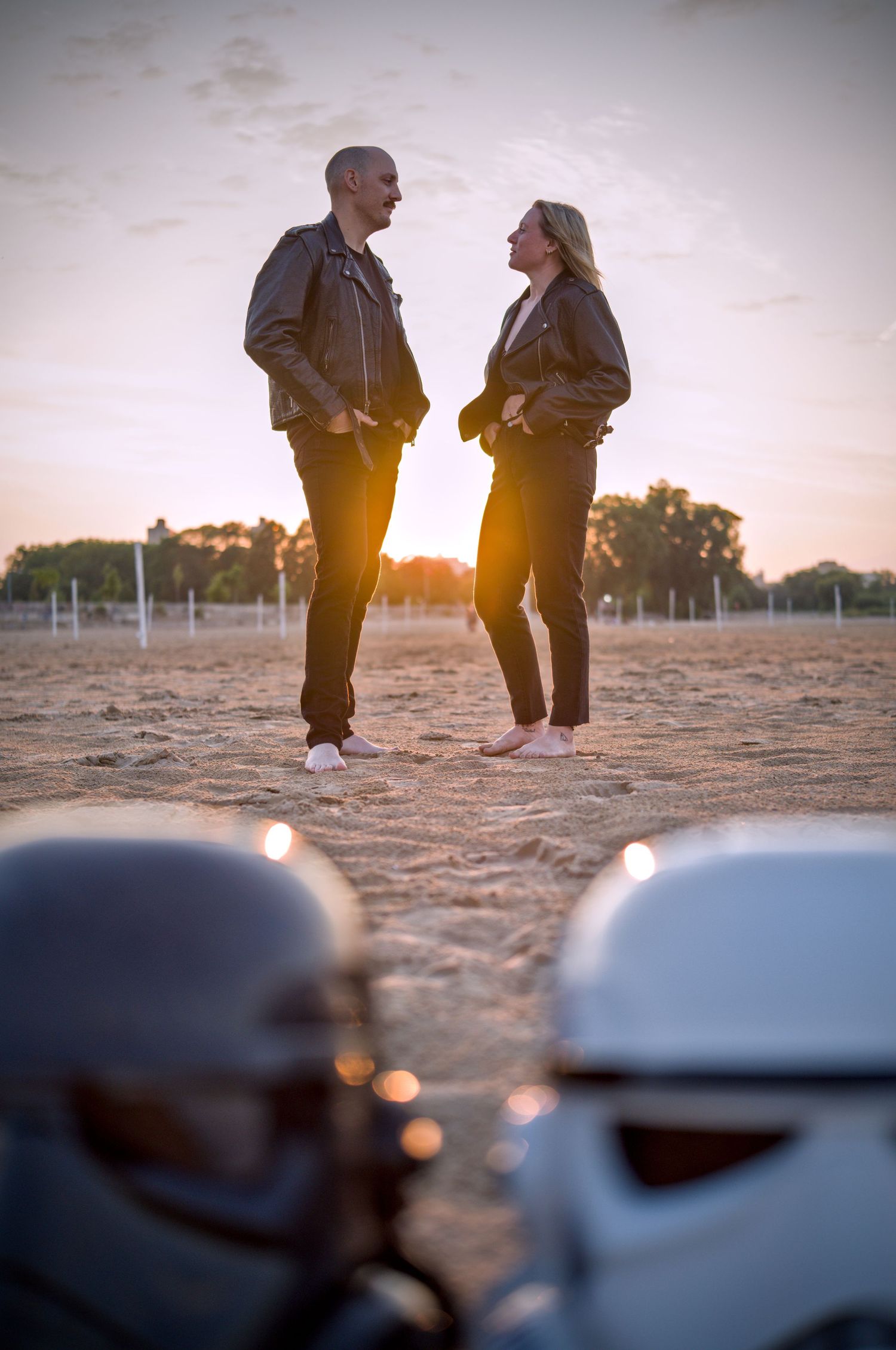 Stormtrooper helmets and figures photographed against a sunset backdrop.