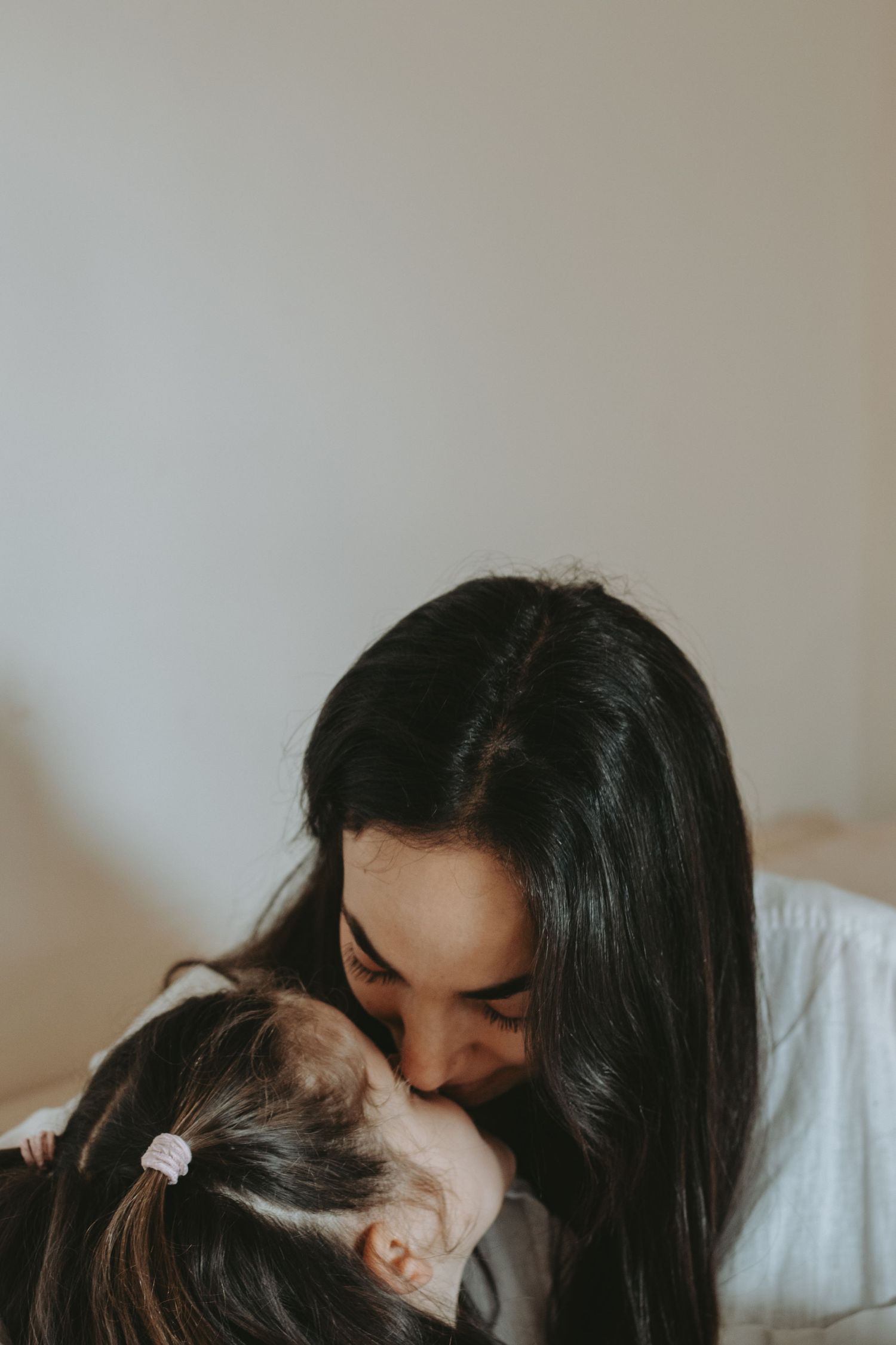 An intimate close-up moment of affection between parent and child.