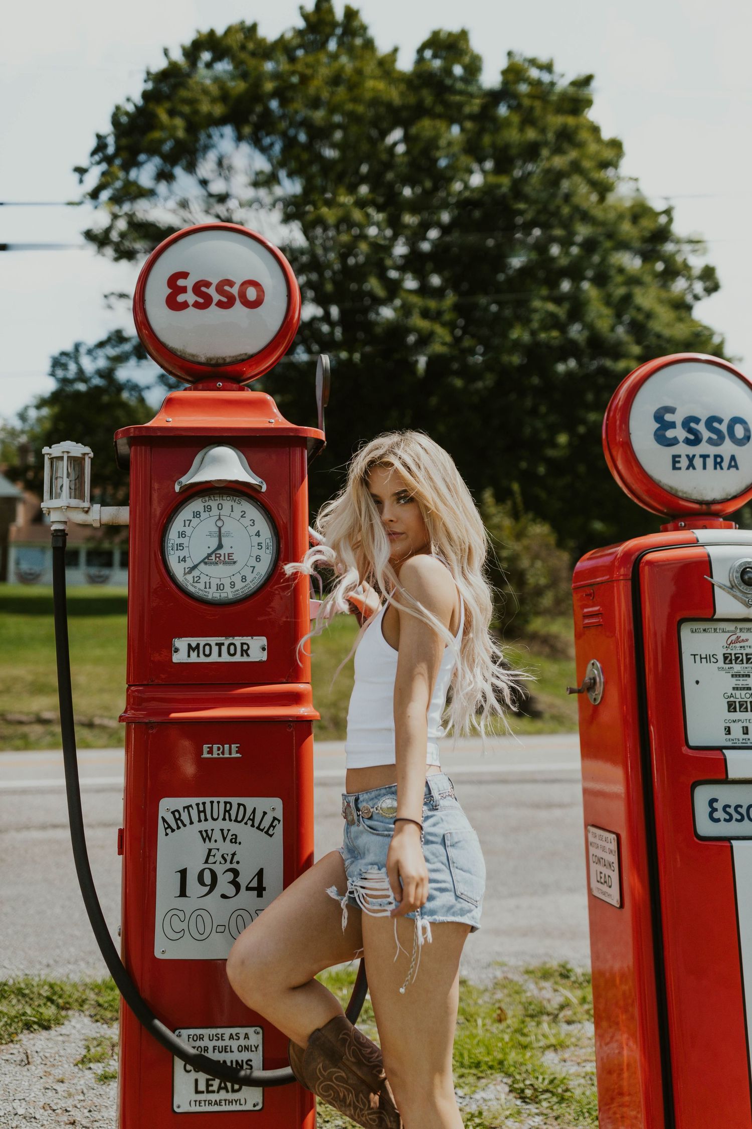 Retro styled photoshoot with vintage Esso gas pumps from 1934.