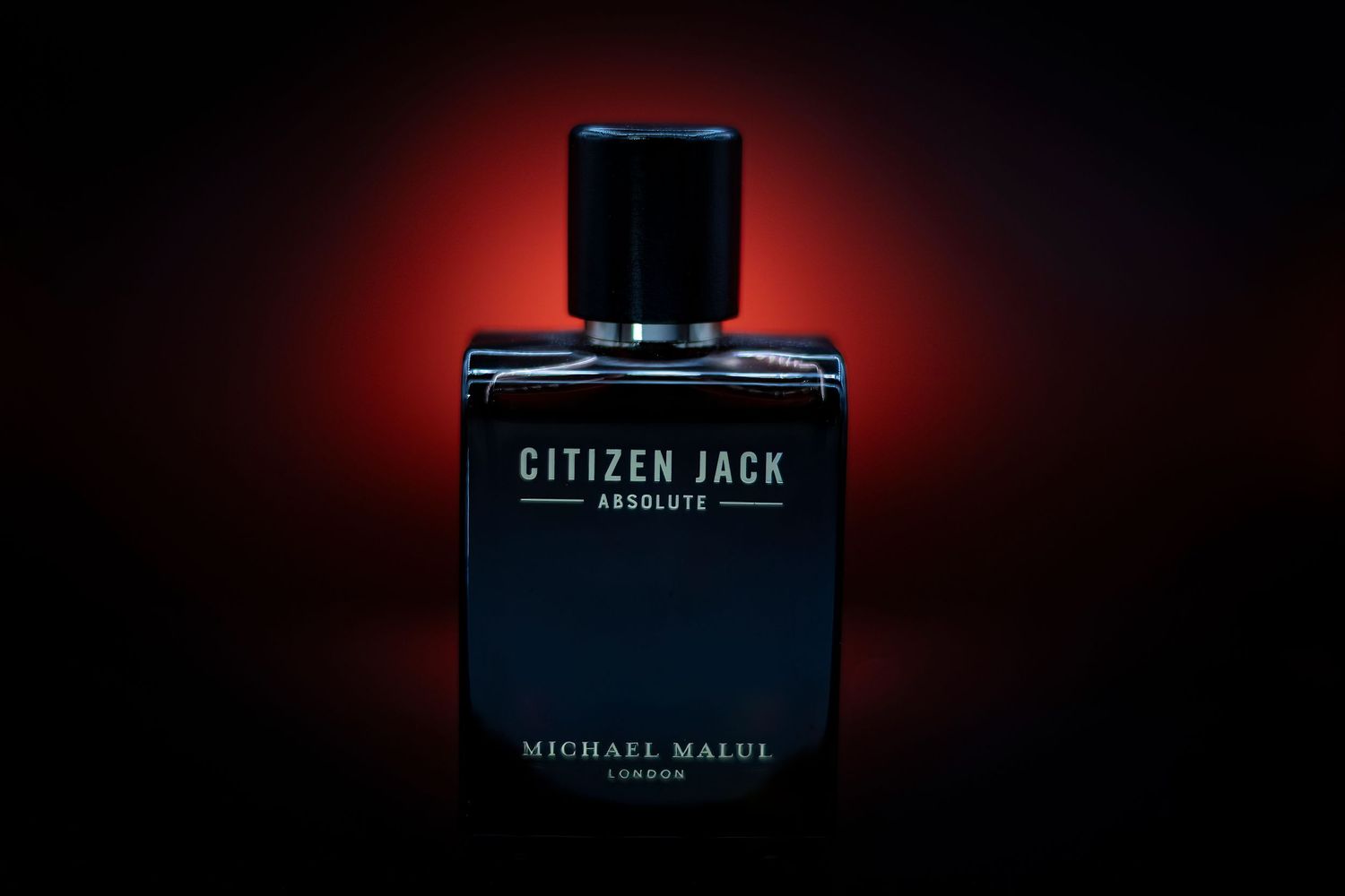 Commercial product photo of a cologne bottle with dramatic studio lighting