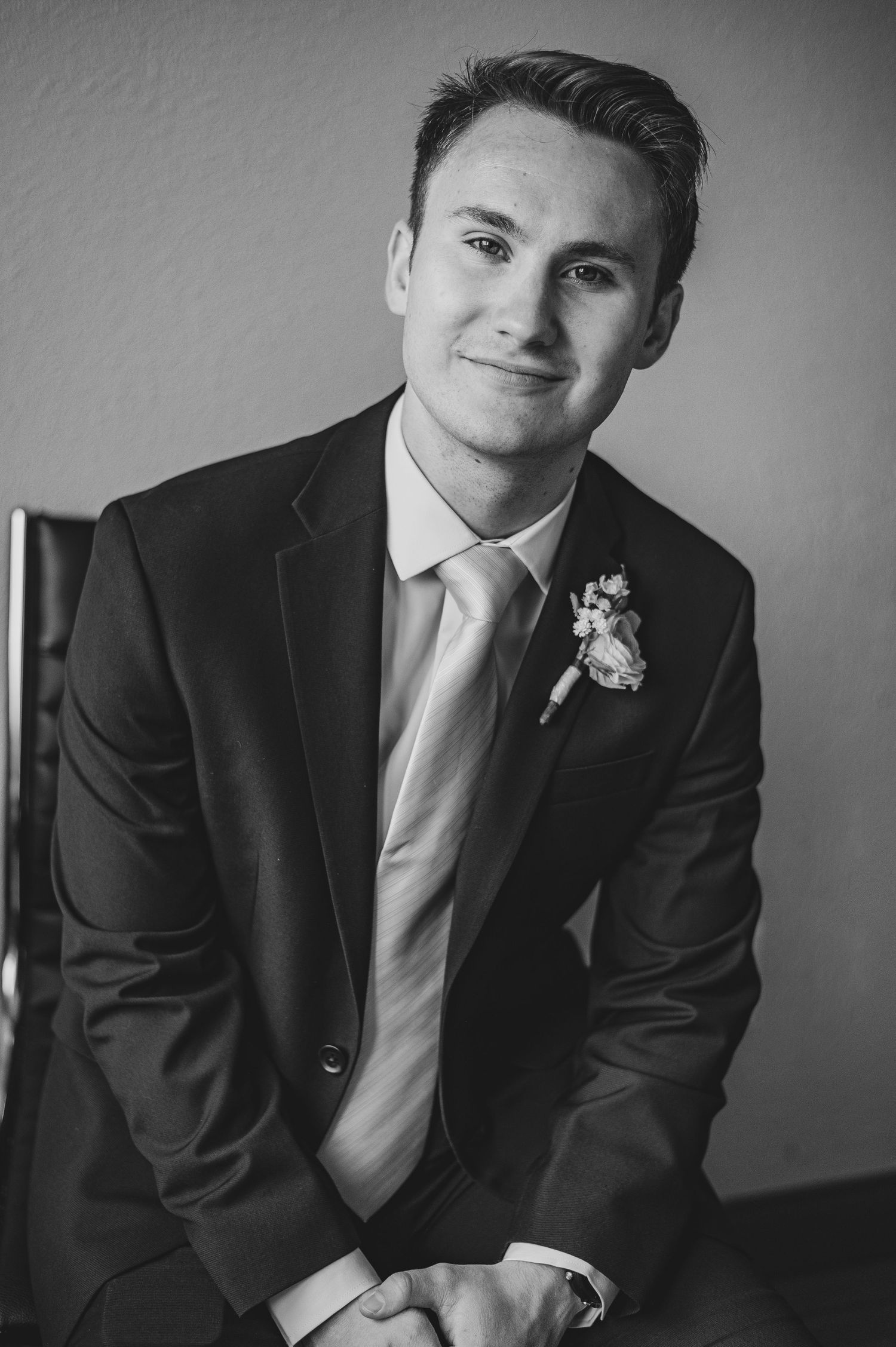 Professional black and white portraits showing formal attire and contemplative poses.