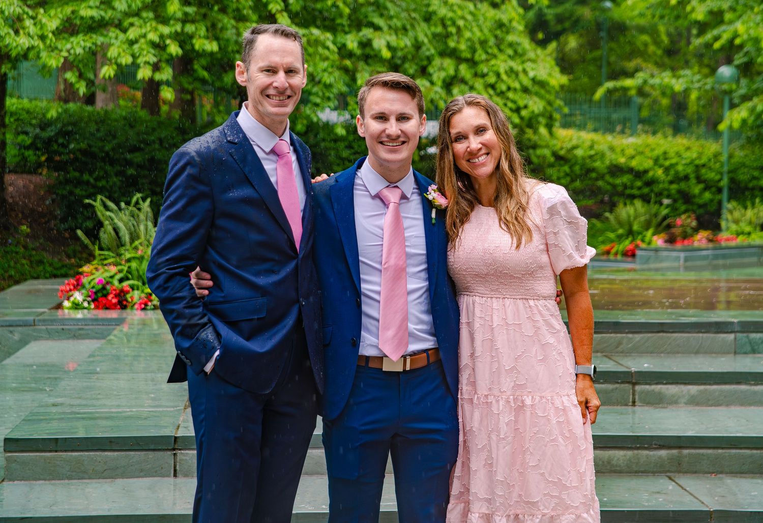 Garden wedding photos featuring bridal party in pastel colors and formal wear.