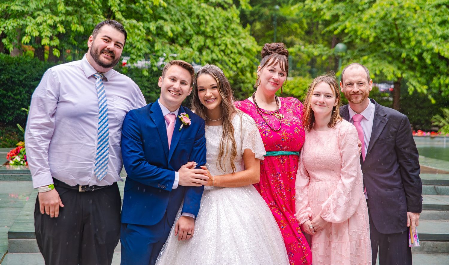Wedding celebration photos with bridal party in pink dresses against lush garden backdrop.