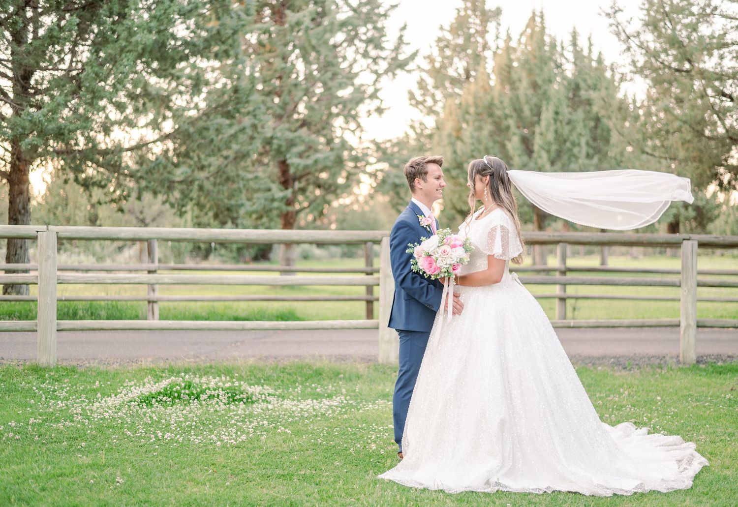 Wedding couple photographed in sequence against rustic outdoor backdrop with wooden fencing.