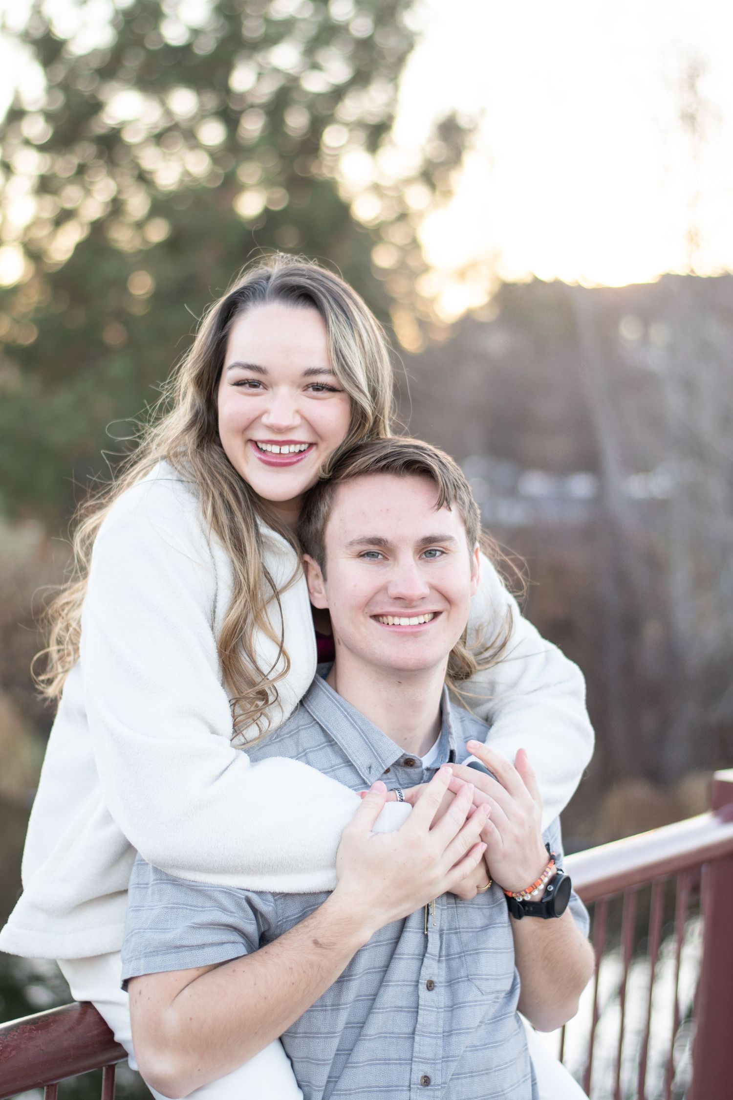 Candid outdoor portrait session with natural smiles and winter attire.