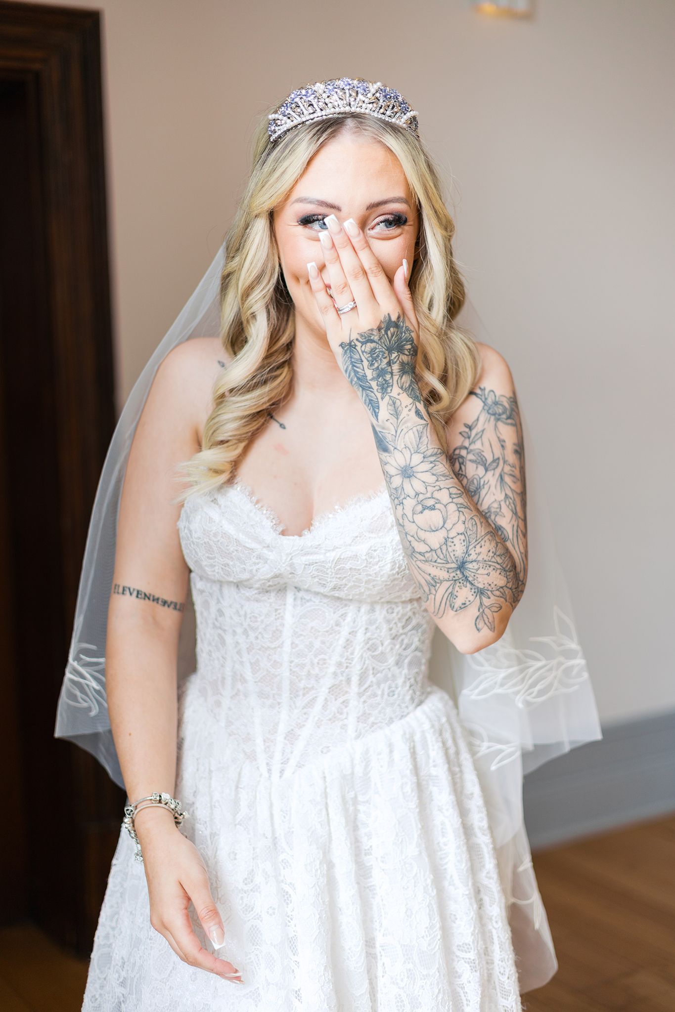 A bride wearing a lace wedding gown and veil poses playfully in a sequence of candid getting-ready photos.