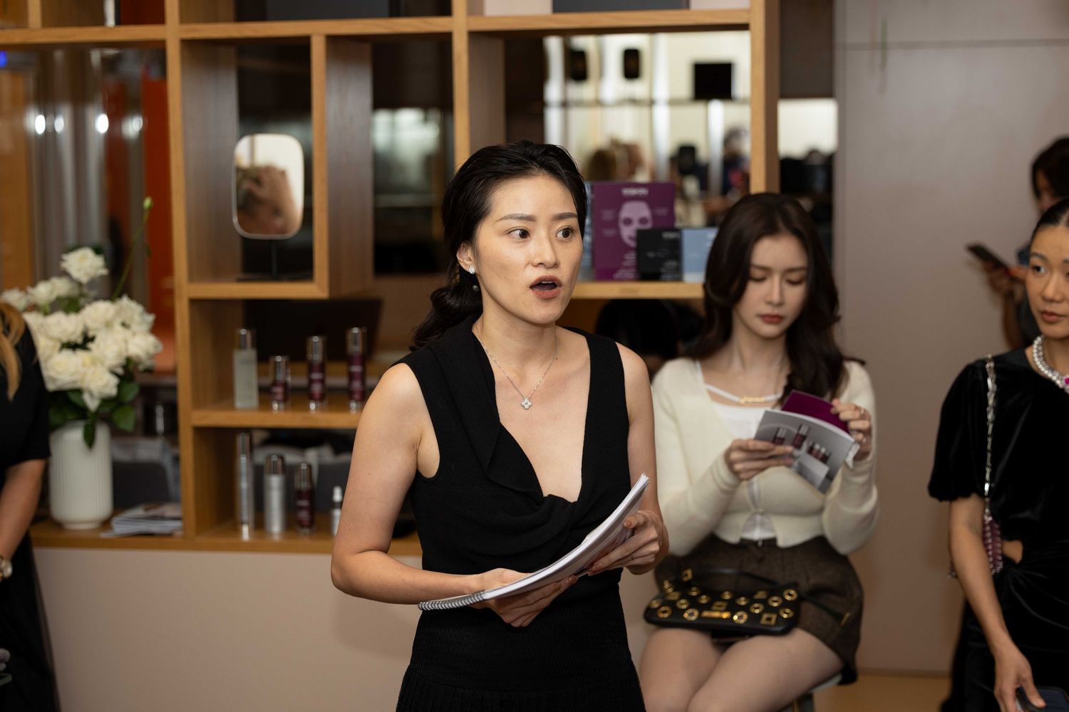 Salon staff members prepare for a beauty demonstration.