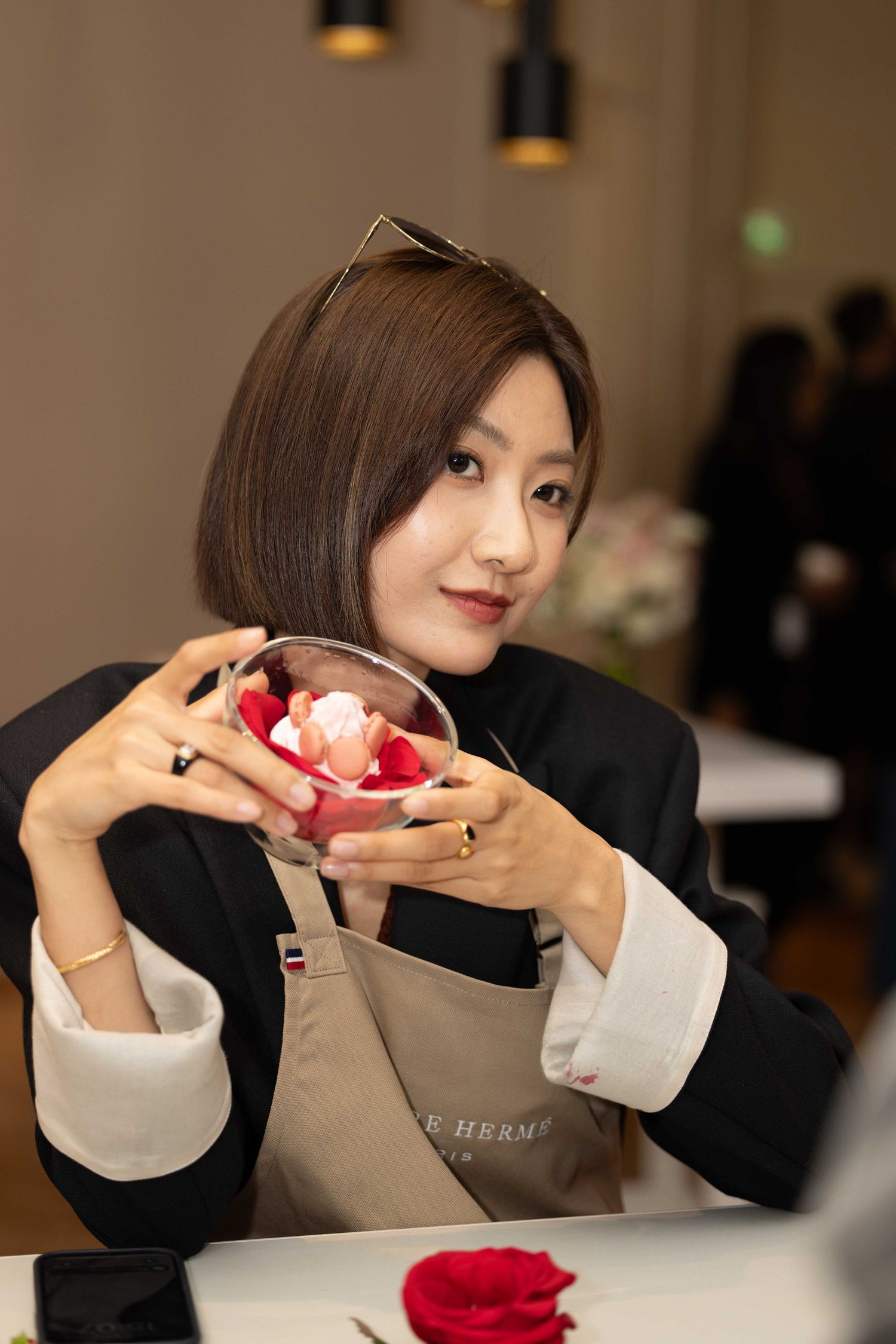 Someone carefully examining and working with a dessert creation during a culinary class.