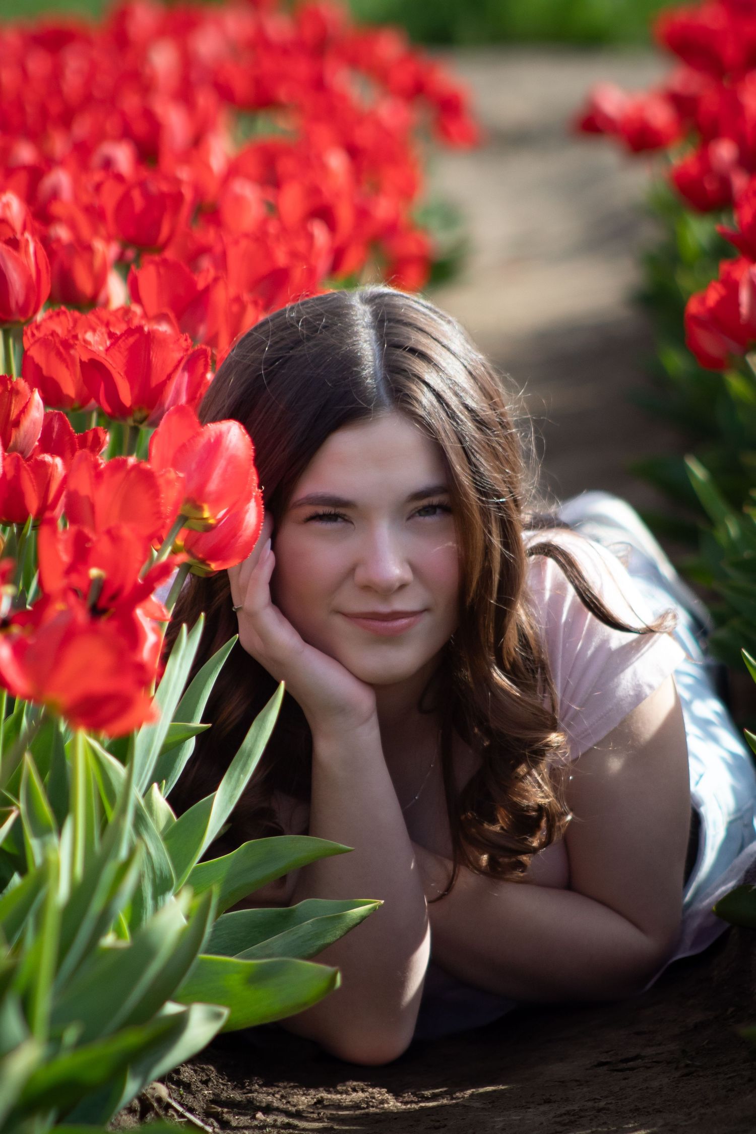 True to life image of a high school senior in tulips