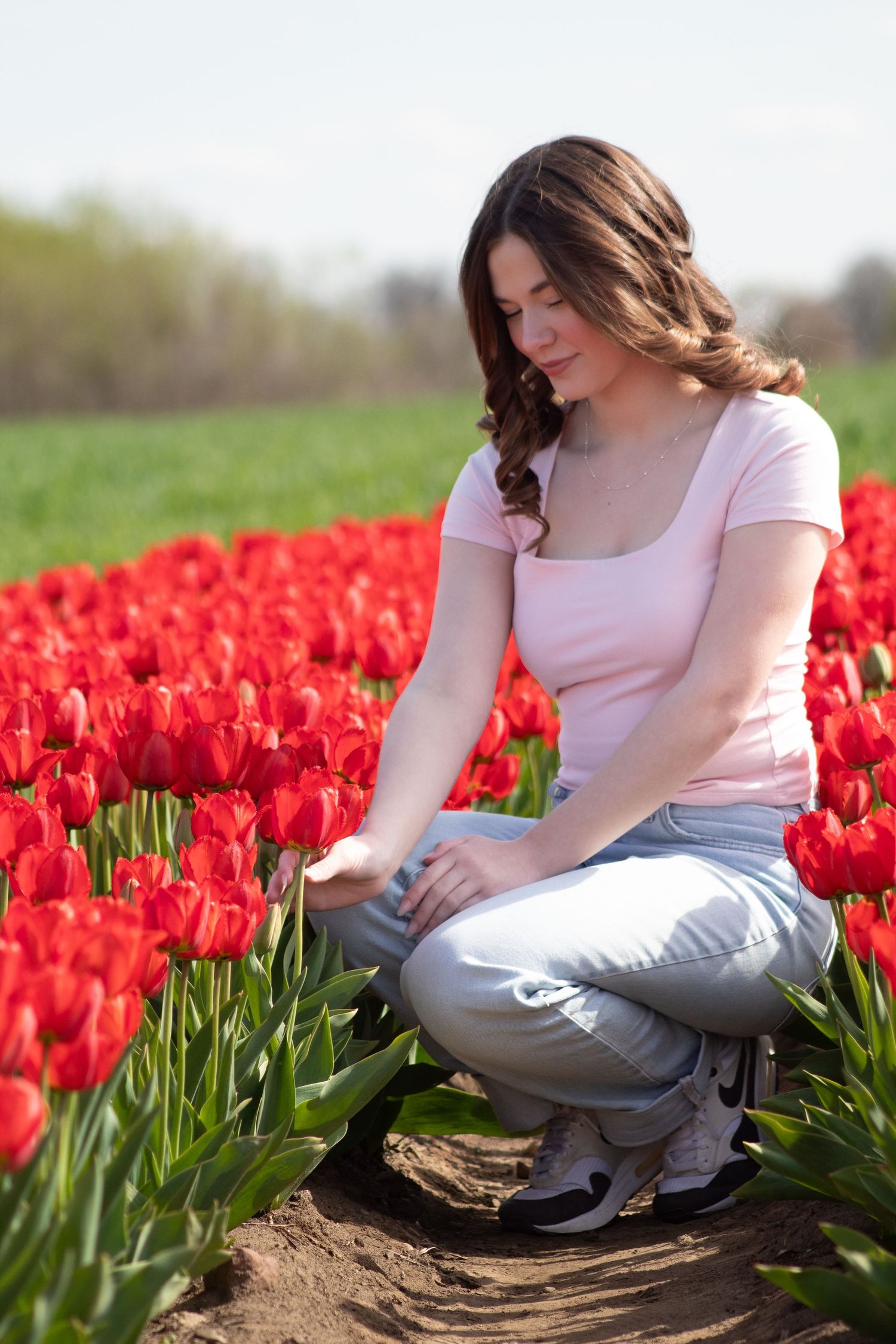 True to life image of a high school senior in tulips