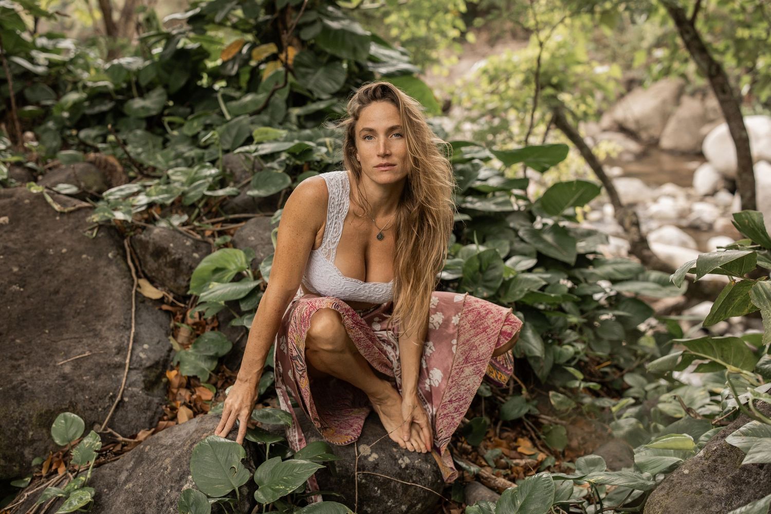 woman sitting in Maui forest