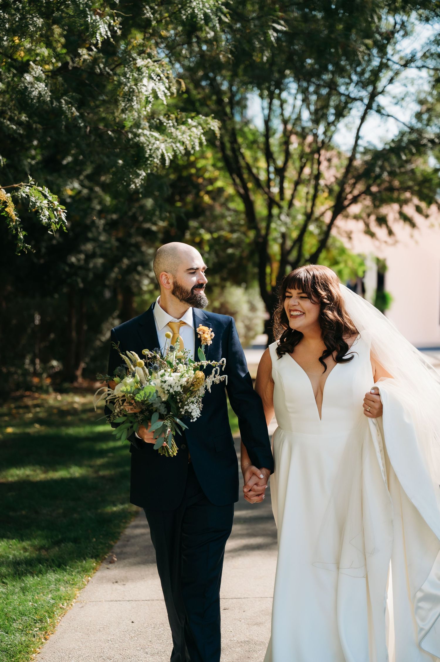Wedding couple walking outside BASH venue in downtown Des Moines Iowa