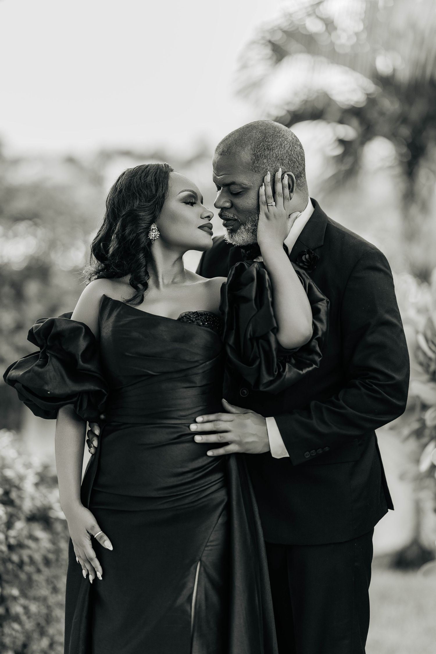 A black and white series of intimate portraits showing a couple in formal wear sharing tender moments together.