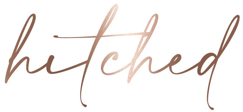 Rose gold calligraphy text reading 'hitched' in elegant script style.