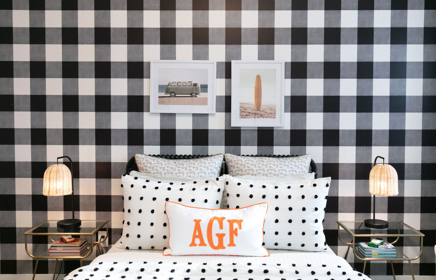 Black and white buffalo check wallpaper bedroom with polka dot bedding and orange monogram AGF pillow.