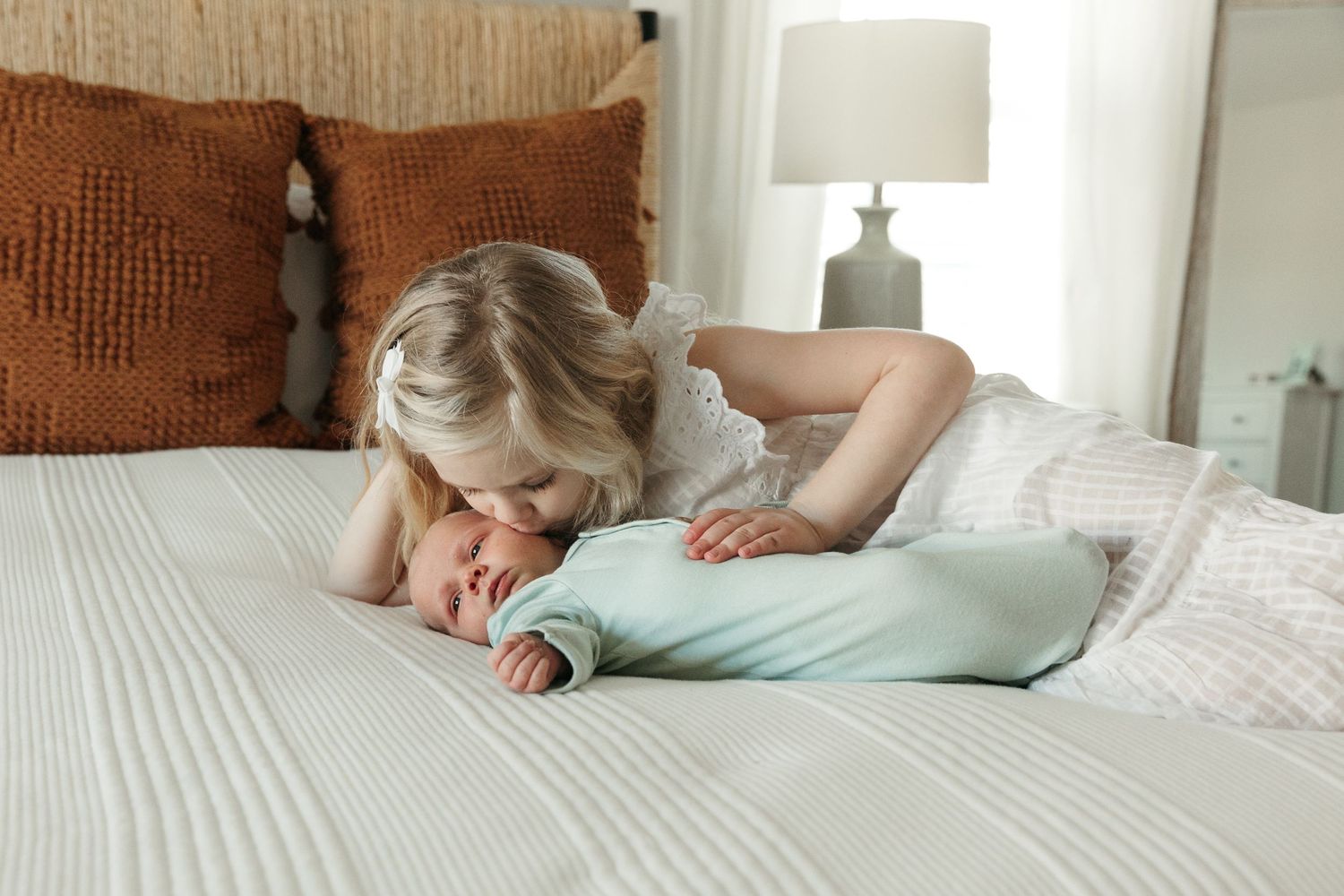 Peaceful bedroom scene showing restful moments on white bedding.