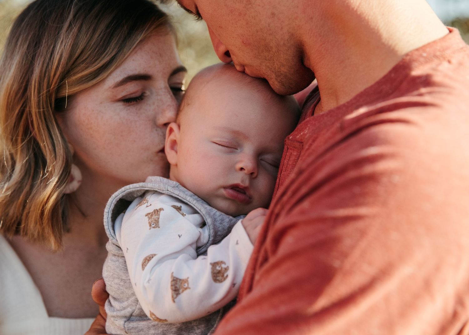 An intimate family moment captured in soft, warm lighting.