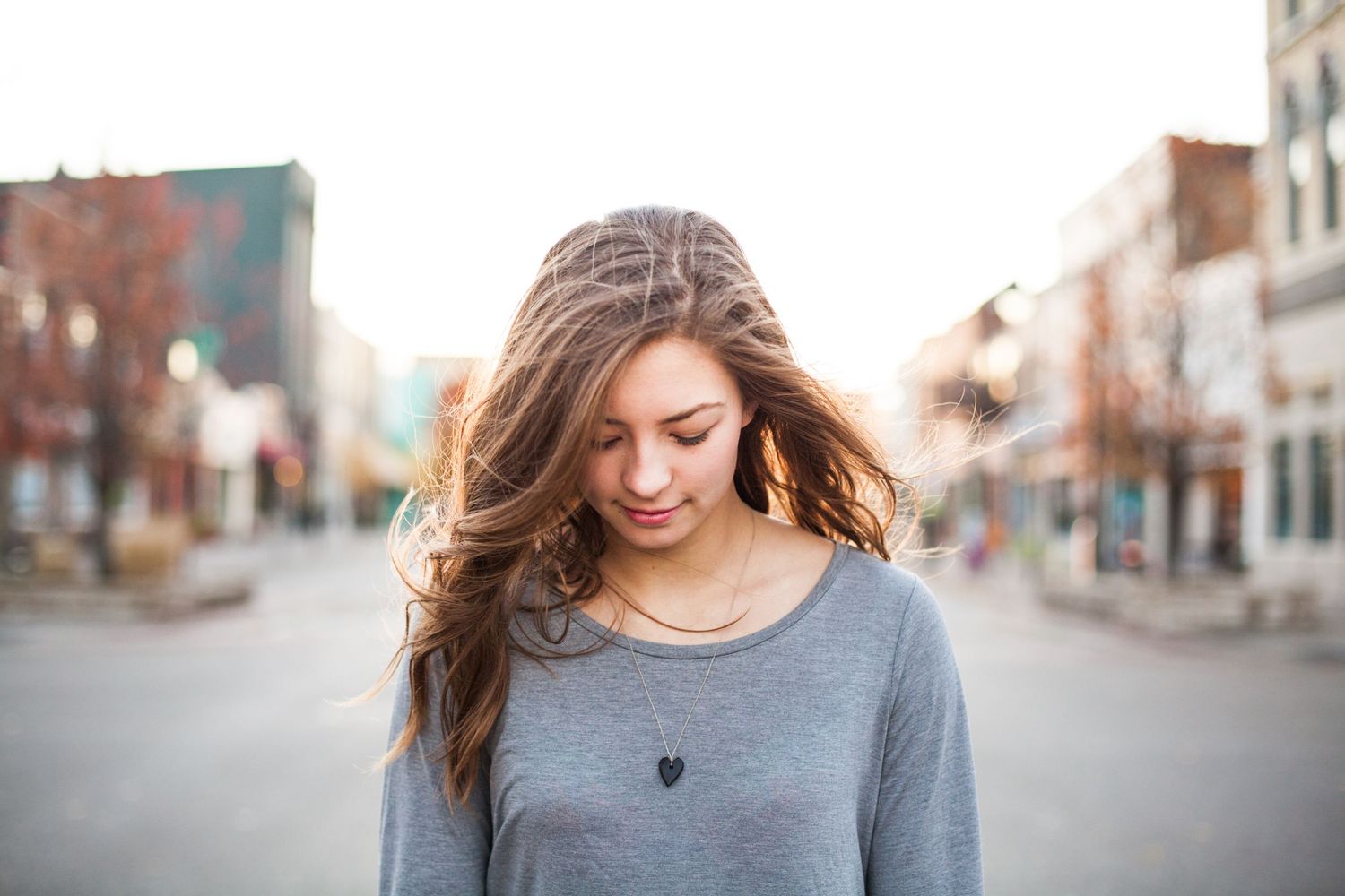 Casual street photography session with soft bokeh background.