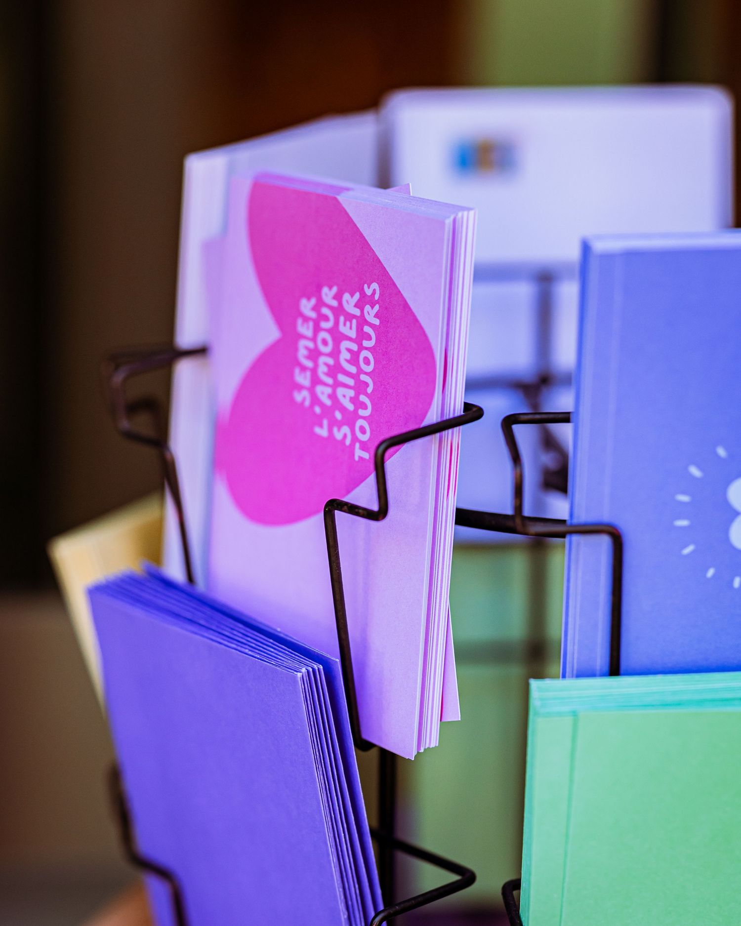 Colorful tabbed dividers in pink, purple, and teal arranged in a row with overlapping sections.