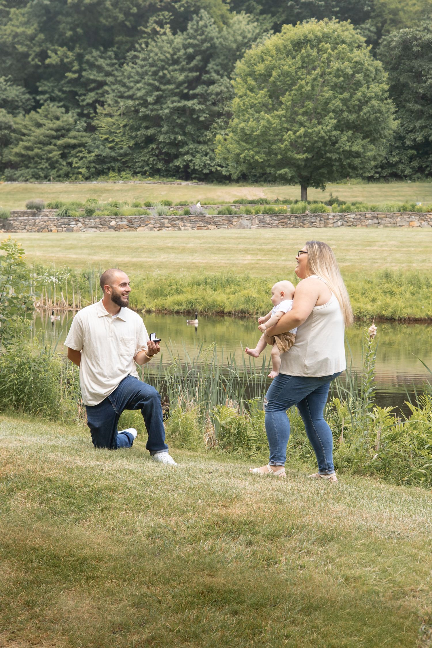 A progression of photos showing a marriage proposal sequence outdoors by a serene pond on a sunny summer day.