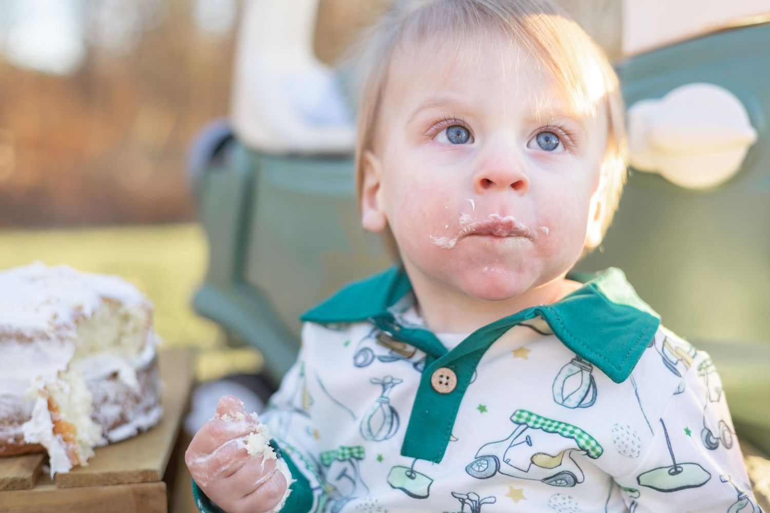 A series of candid shots showing a small child in a green shirt eating cake and getting messy with frosting.