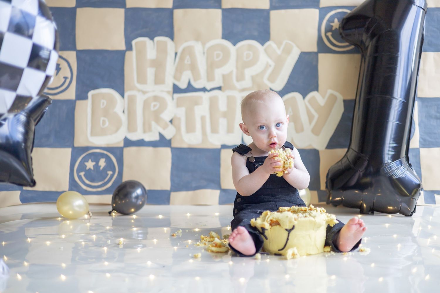A happy birthday party scene with colorful decorations and a festive checkerboard backdrop.