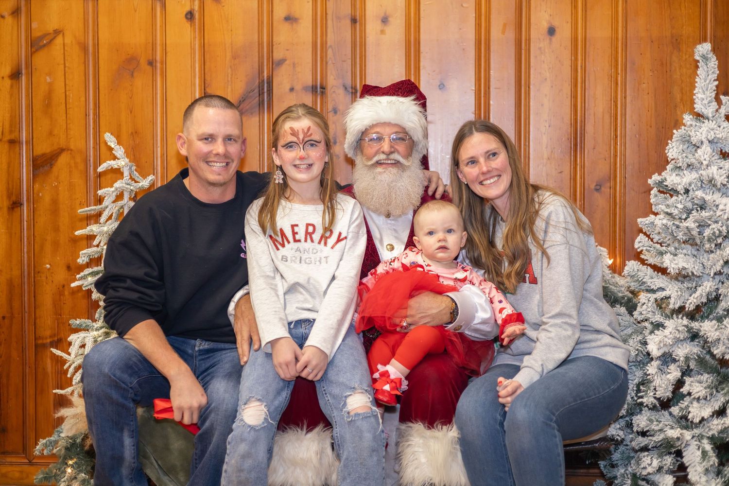 A collection of holiday photos with festive decorations and a traditional Santa Claus figure.