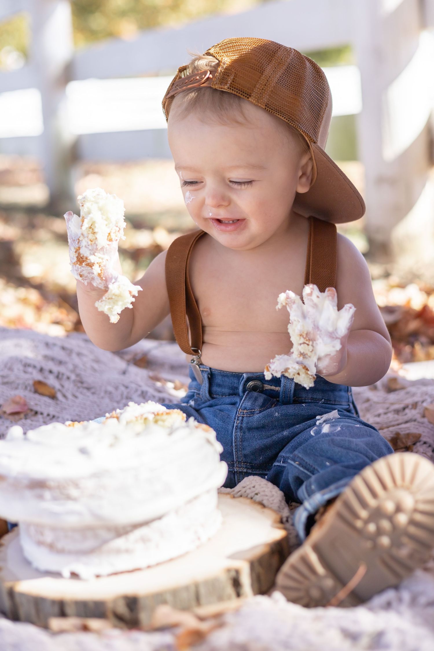 Four sequential photos show a small child in a brown cap playing with a white fluffy dandelion in sunny outdoor lighting.