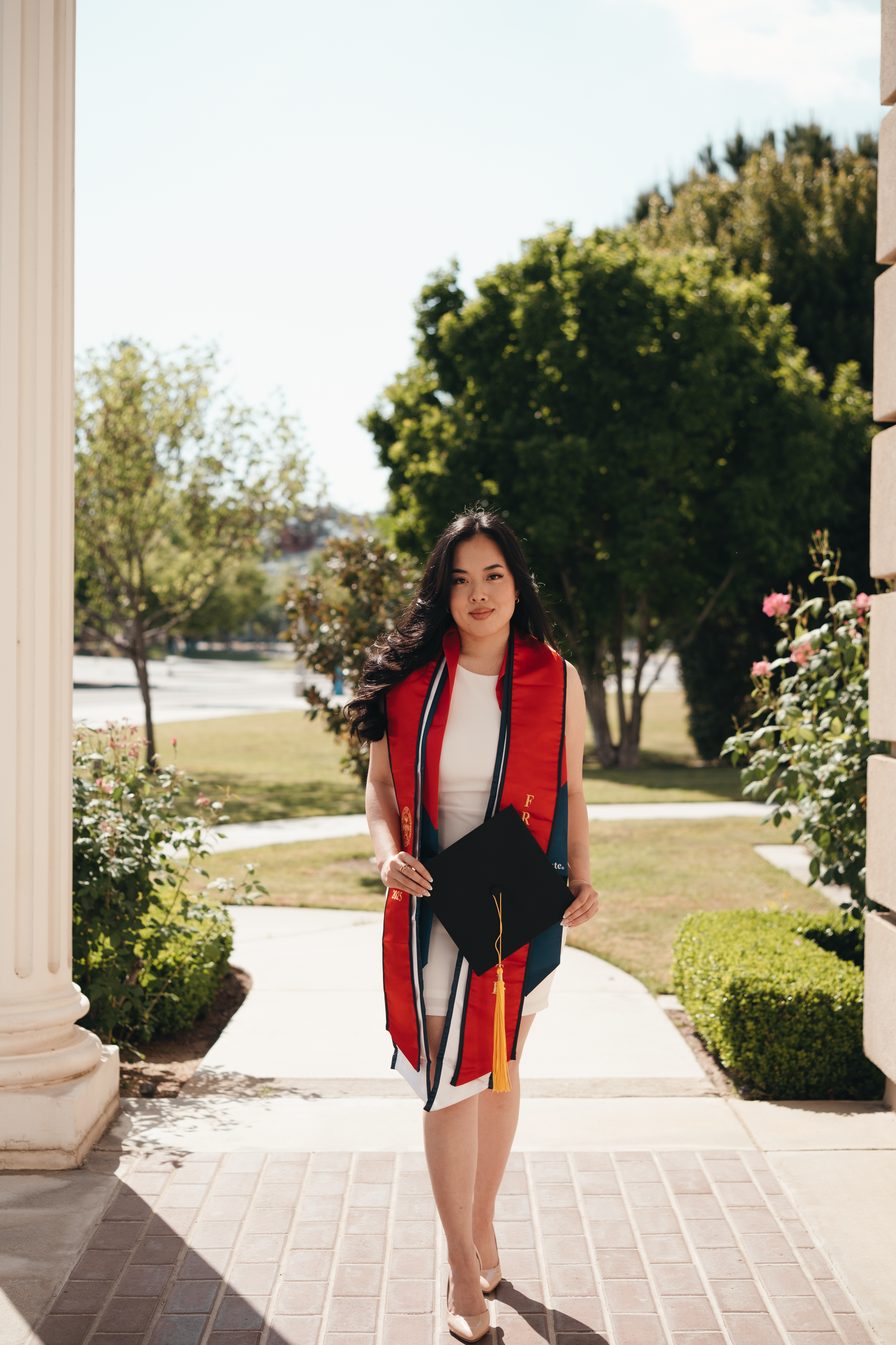 Newly graduate holding tassel at Fresno State