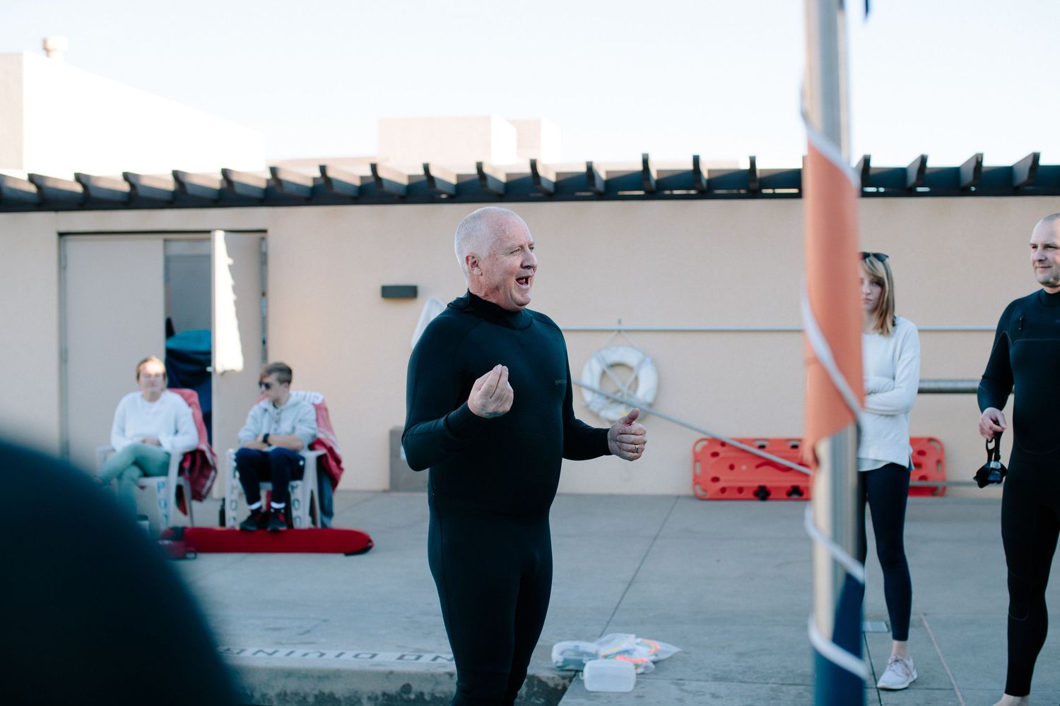 People performing synchronized movements in an outdoor space.