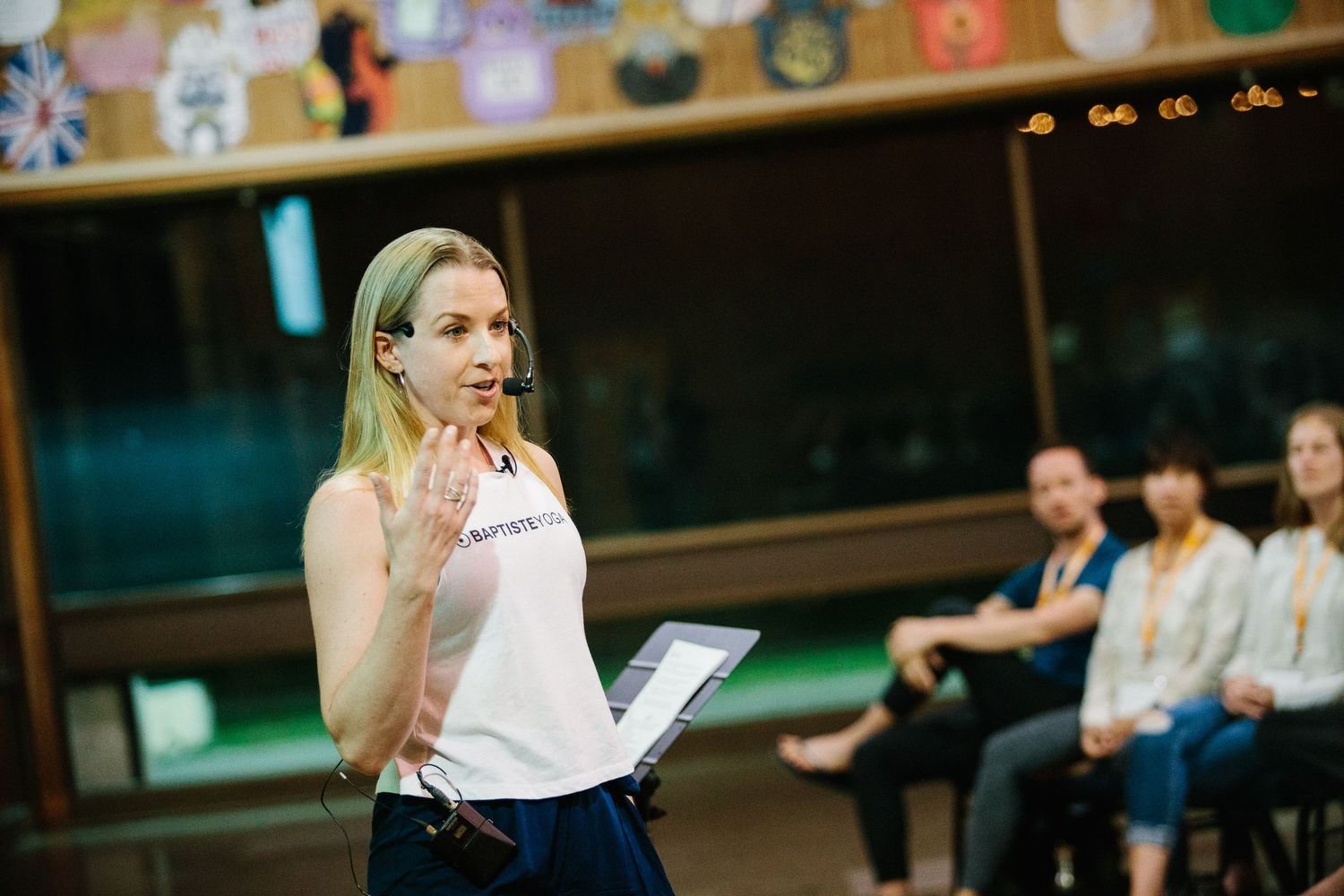Dance students rehearsing together in a studio with colorful decorations on the walls.