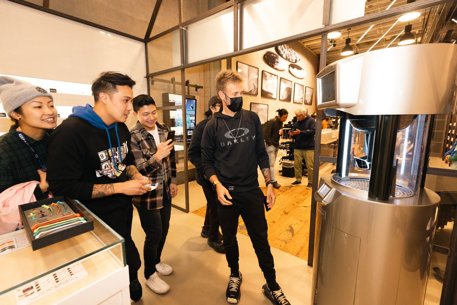 Customers browsing merchandise displays inside a modern retail store.