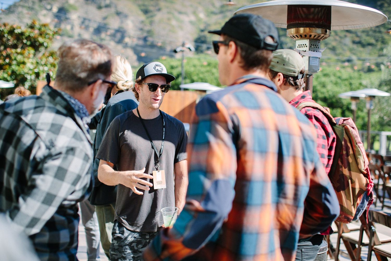 Candid shots of attendees at an outdoor event wearing casual attire.