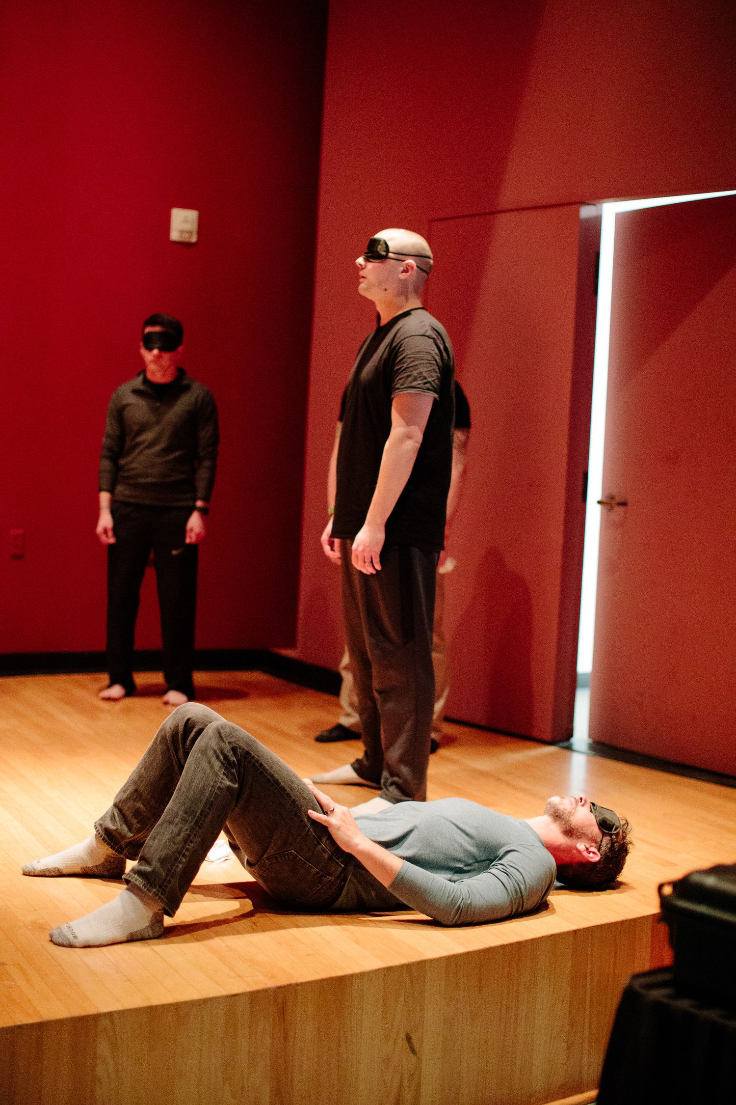 Training sequence showing staged physical interactions on a wooden platform with red walls.