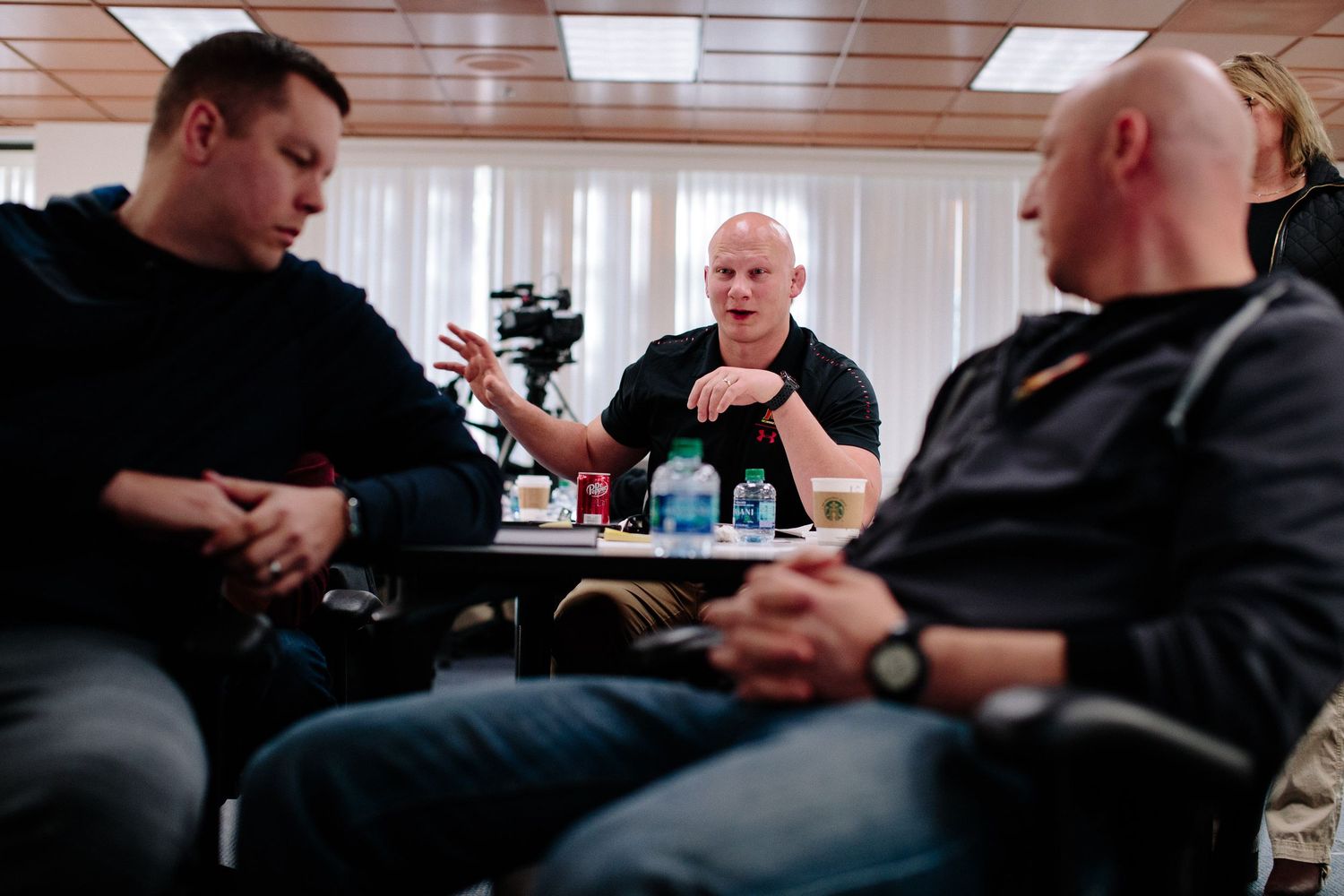 Attendees seated in a conference room during a professional meeting or training session.