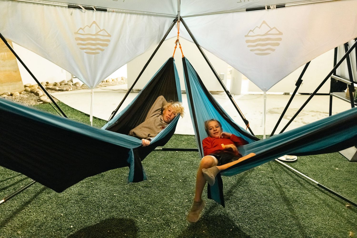 A series of hang glider wings arranged in sequence showing the steps of setting up and launching a hang glider.