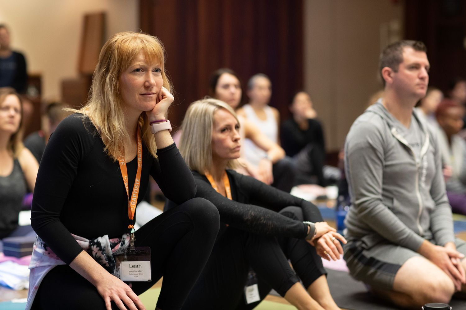 Workshop participants sit attentively during a wellness seminar.