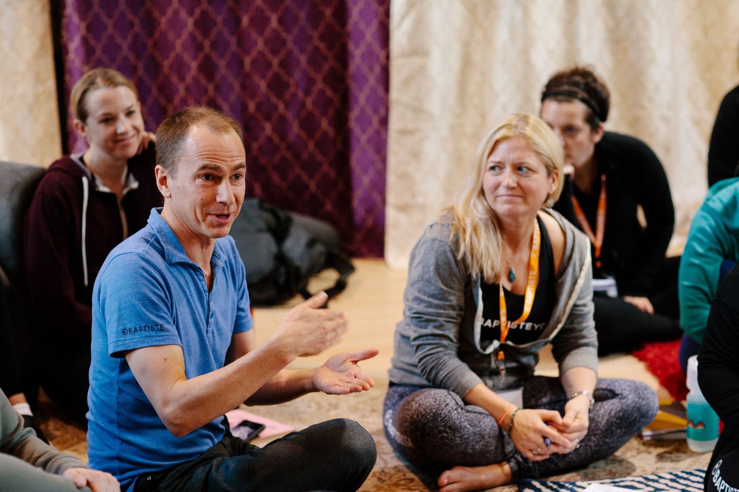 Participants engaging in animated discussion during a group workshop session.