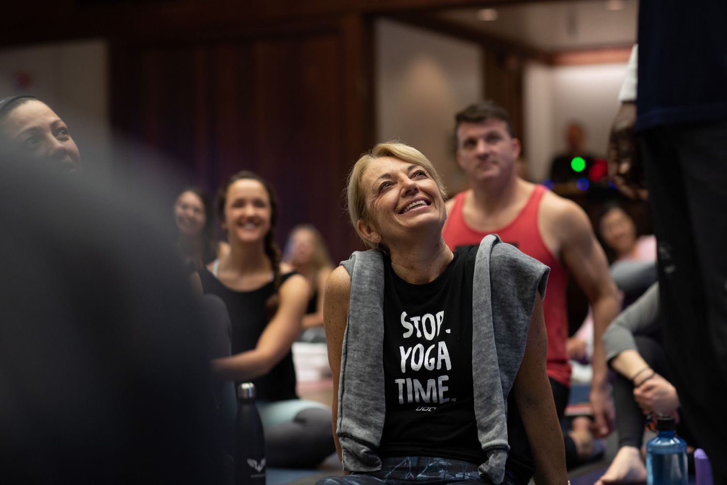 Participants share a laugh during an indoor wellness workshop.