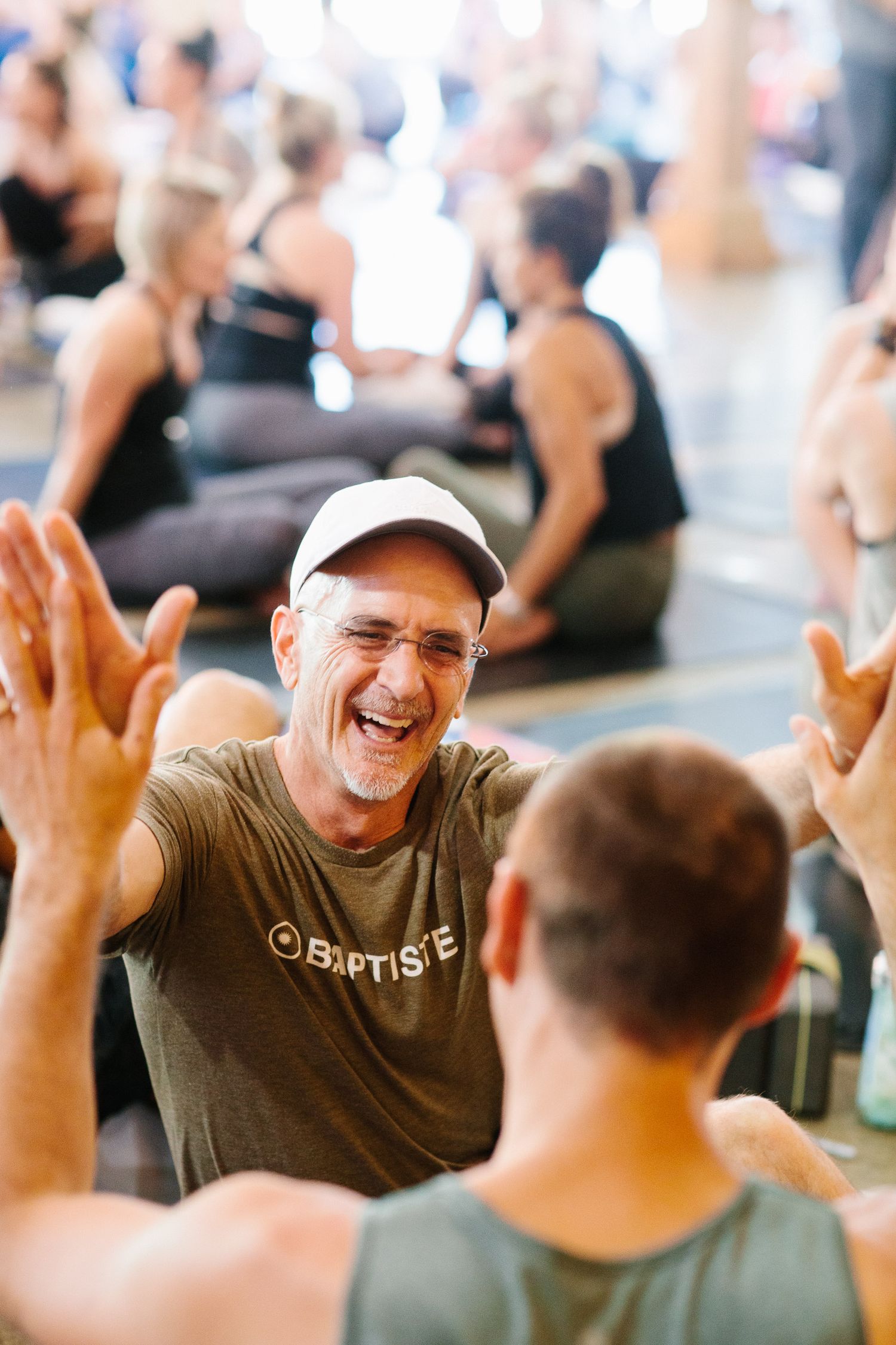 People sharing joyful moments during a group wellness gathering.