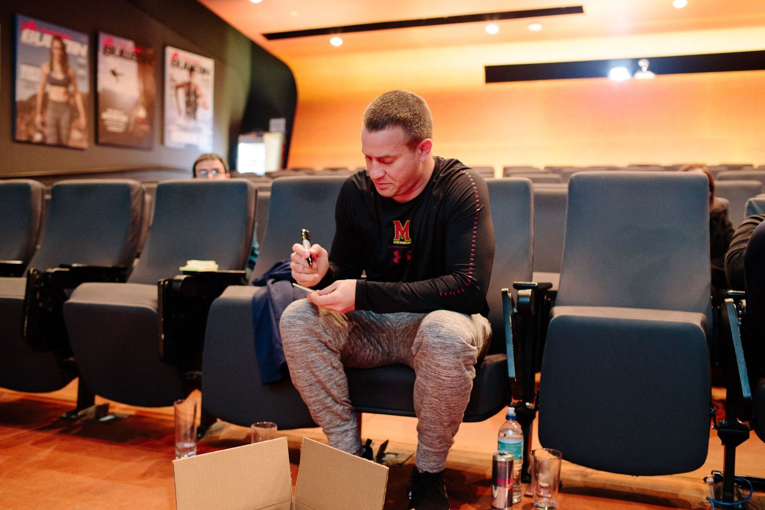 Meeting room with blue chairs arranged for a professional gathering or training event.