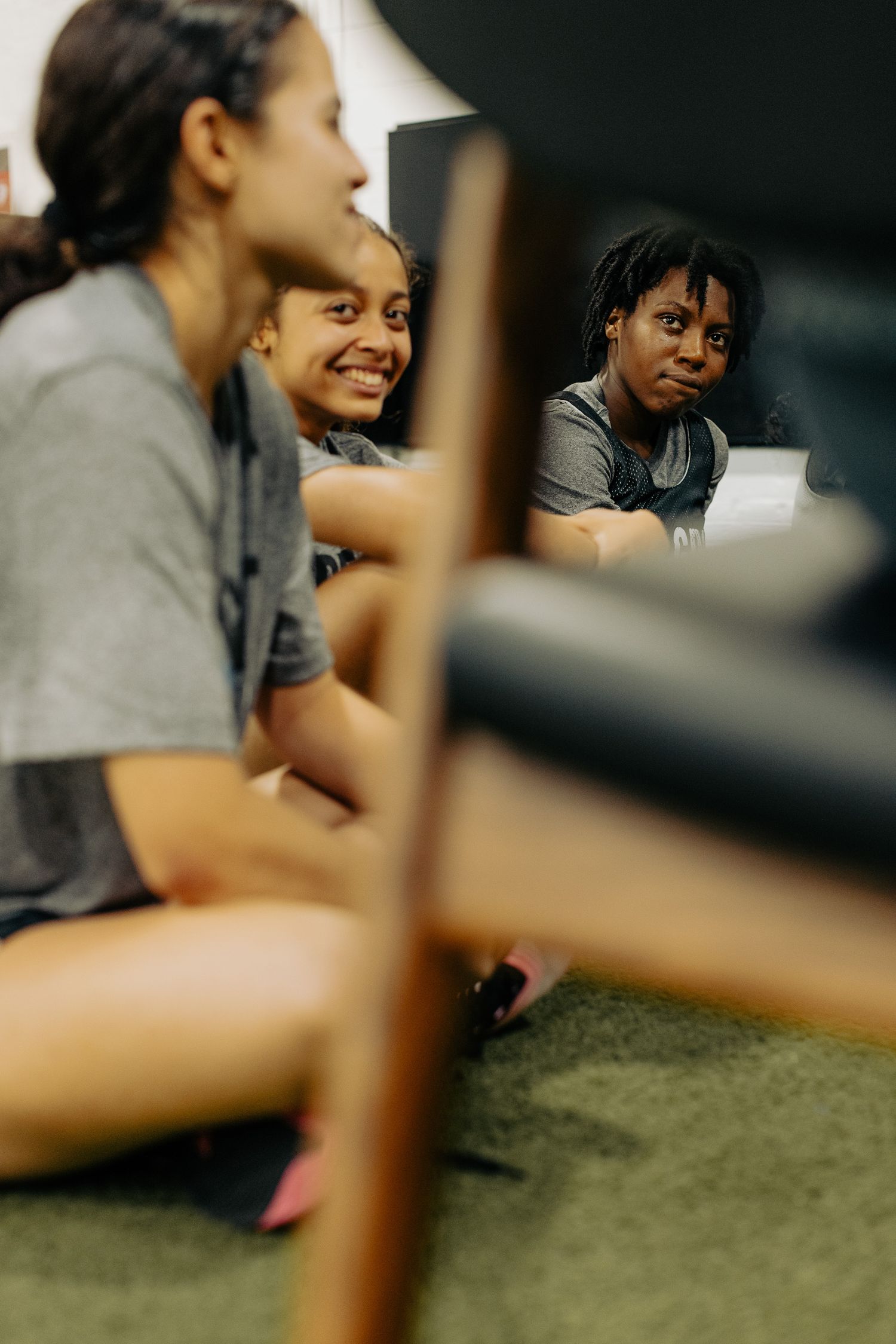 Athletes sitting together during team meeting or training session.